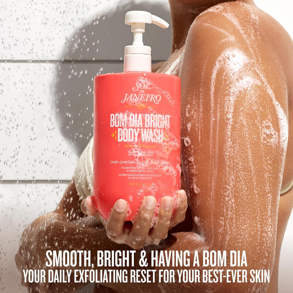 Person holding a bottle of Bom Dia Bright body wash with a shower in the background