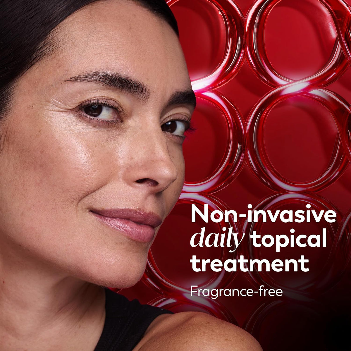 Close-up of a woman's face beside bold red circular graphics and white text reading 'Non-invasive daily topical treatment' and 'Fragrance-free'.