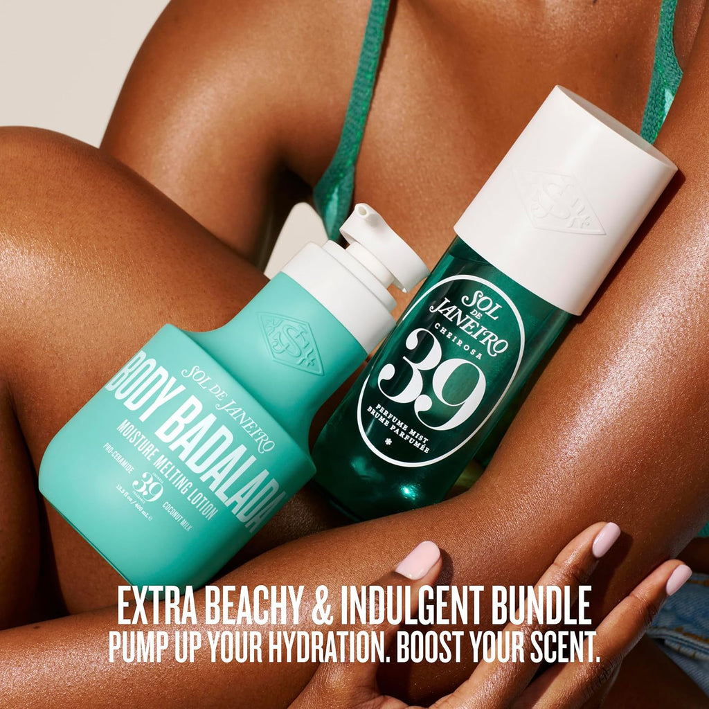 Two Sol Janeiro body care products, Body Badaloo moisturizing lotion and Body Aromatic Massager, displayed on a model's crossed legs. The products are one in a matte teal bottle and the other in a dark green bottle with a white cap, featuring white branding text.