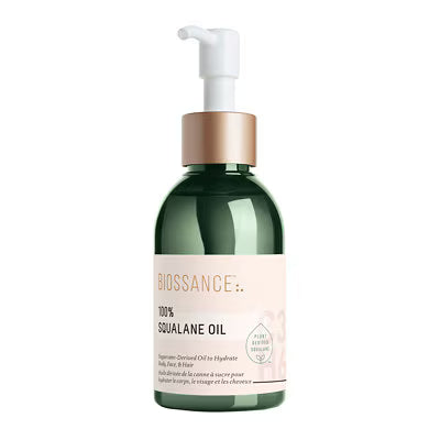 BIOSSANCE 100% Squalane Oil in a dark green pump bottle with a metallic gold collar and a white pump dispenser, set against a plain white background.