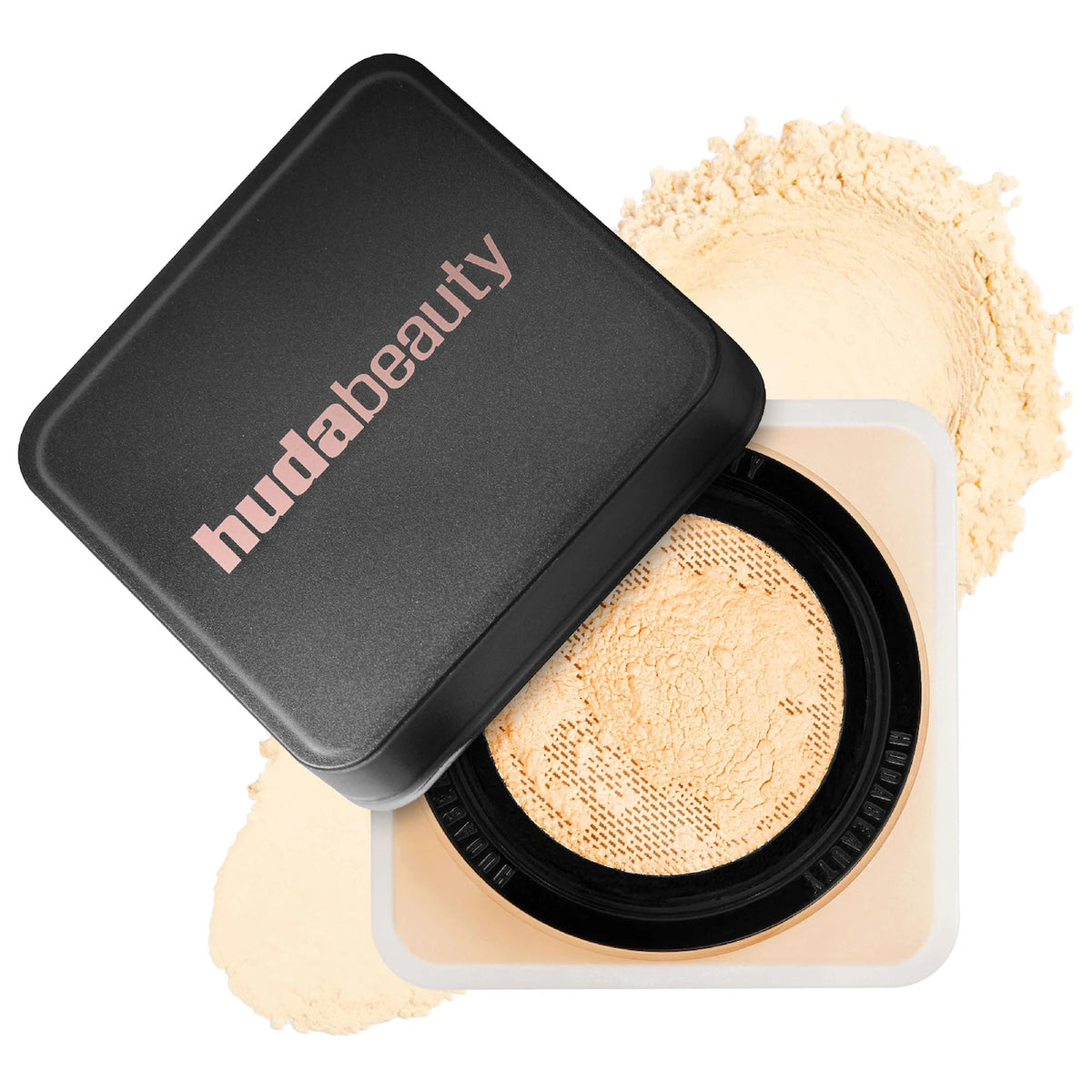 Makeup compact with powder and black lid on a white background