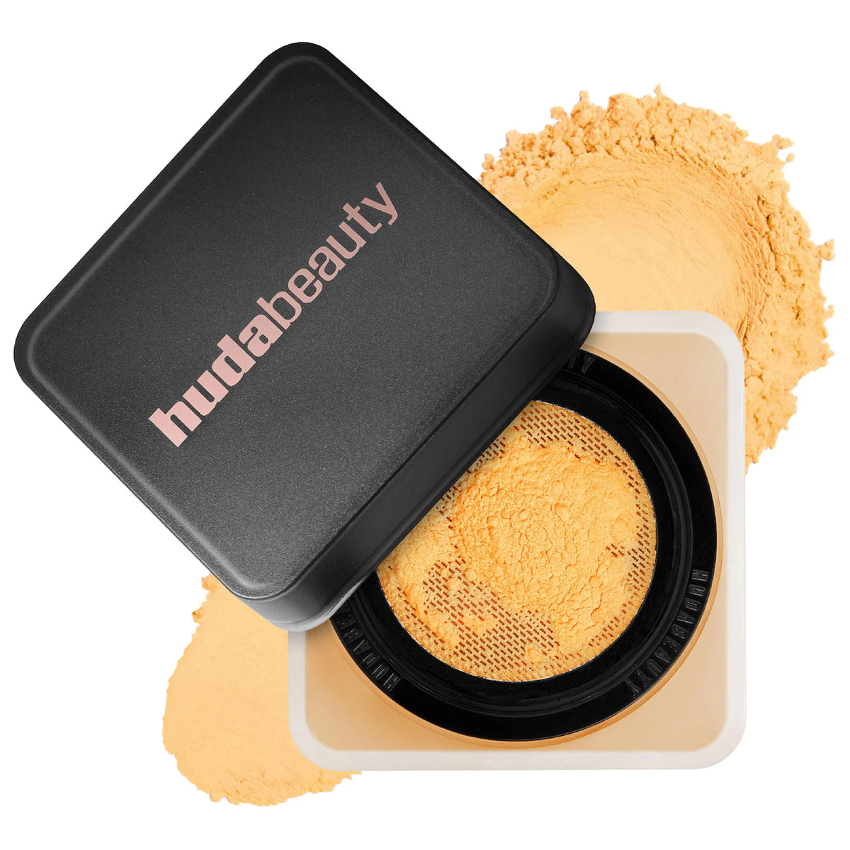 Huda Beauty compact powder with open lid showing yellow powder on a white background