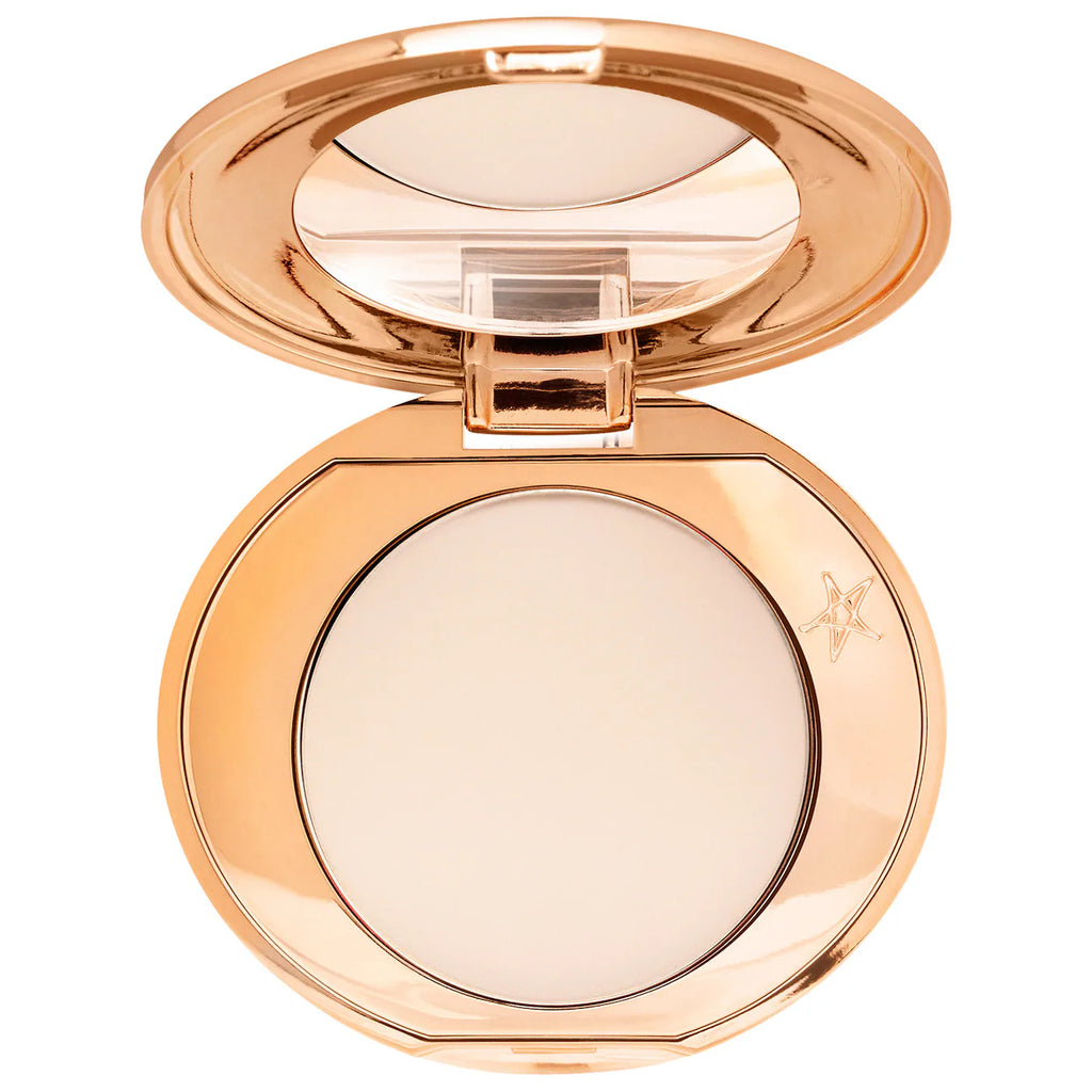 Compact powder in a rose gold case on a white background