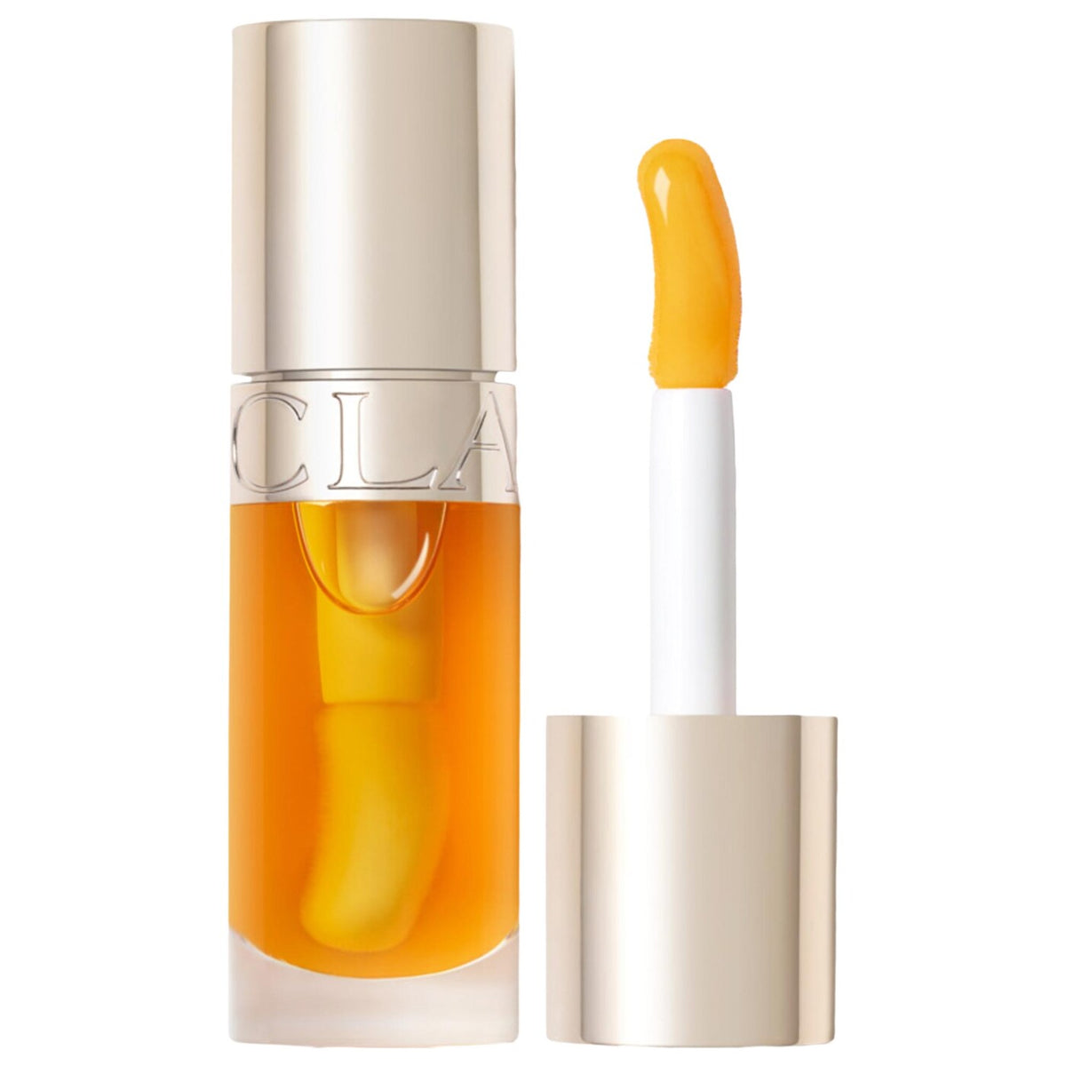 A clear cosmetic bottle filled with bright orange-yellow liquid, shown next to its applicator wand with a white handle and a smear of the same orange-yellow product. The bottle has a reflective metallic cap and a matching metallic band with partial lettering.