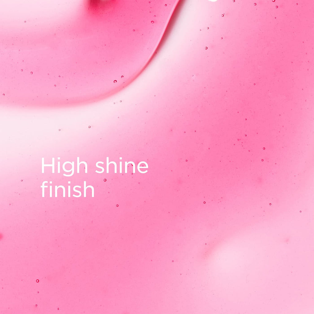 A close-up pink glossy surface with small scattered specks and the text 'High shine finish' in white near the lower left.