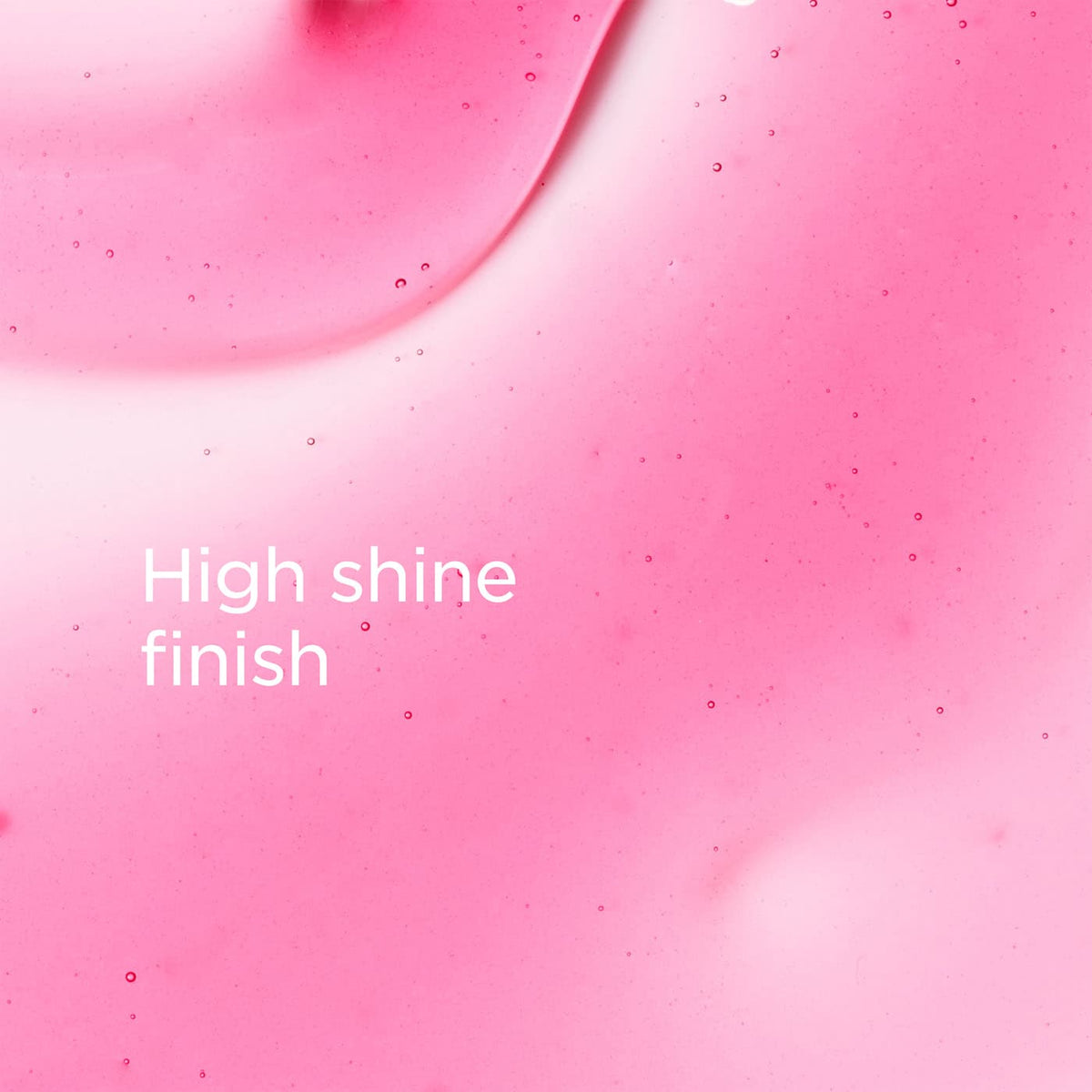 A close-up pink glossy surface with small scattered specks and the text 'High shine finish' in white near the lower left.