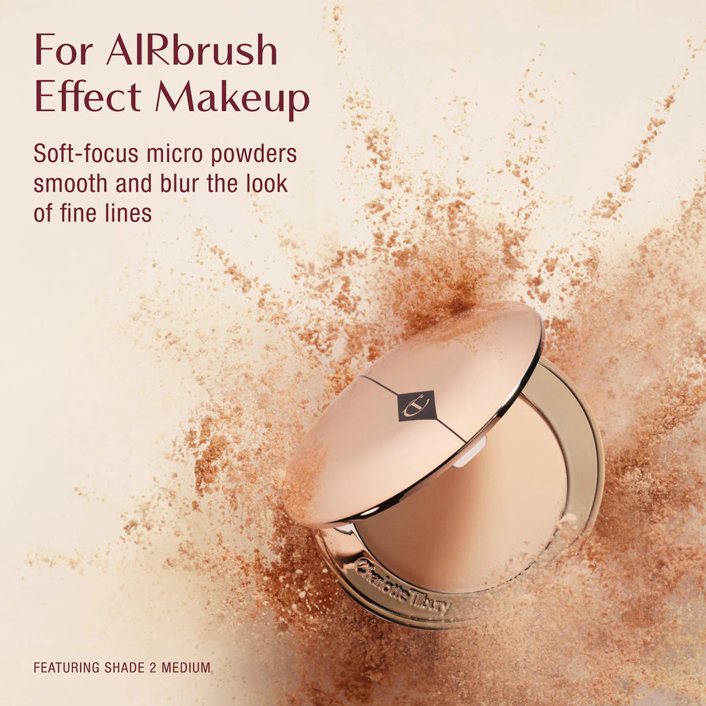 Makeup compact with airbrush effect powder on a beige background