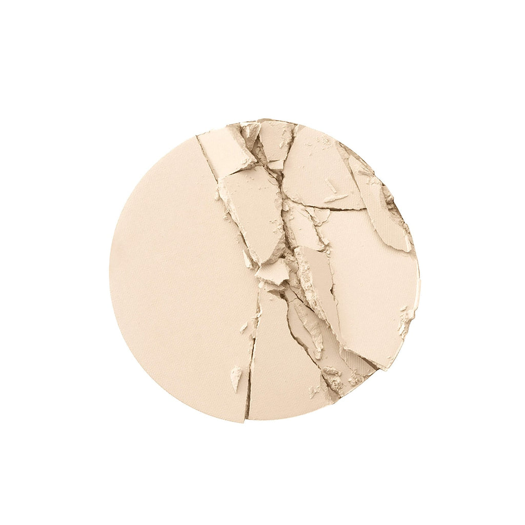 Compact beige powder on a white background