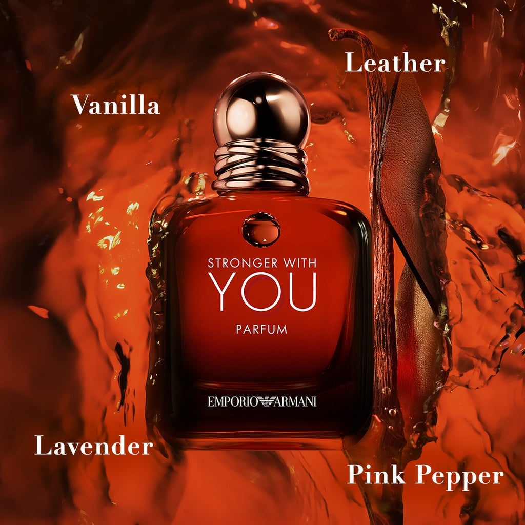 Red perfume bottle labeled 'Stronger with You' by Emporio Armani on a textured red background.